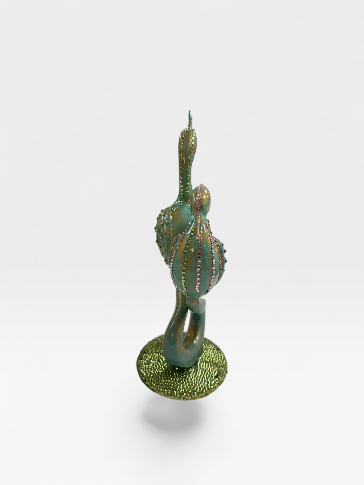 Entwined swans sculpture, teal and gold, side view