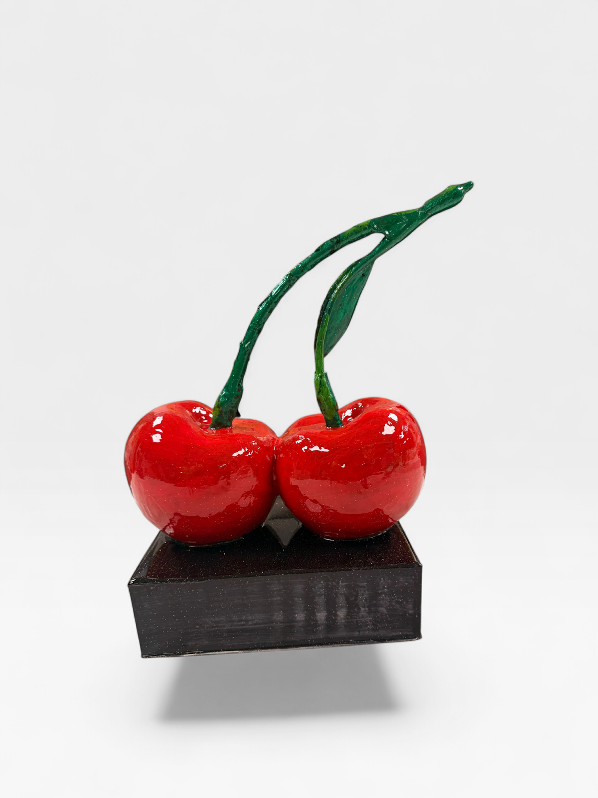 Red cherries pop art sculpture on black base by JebaraArt