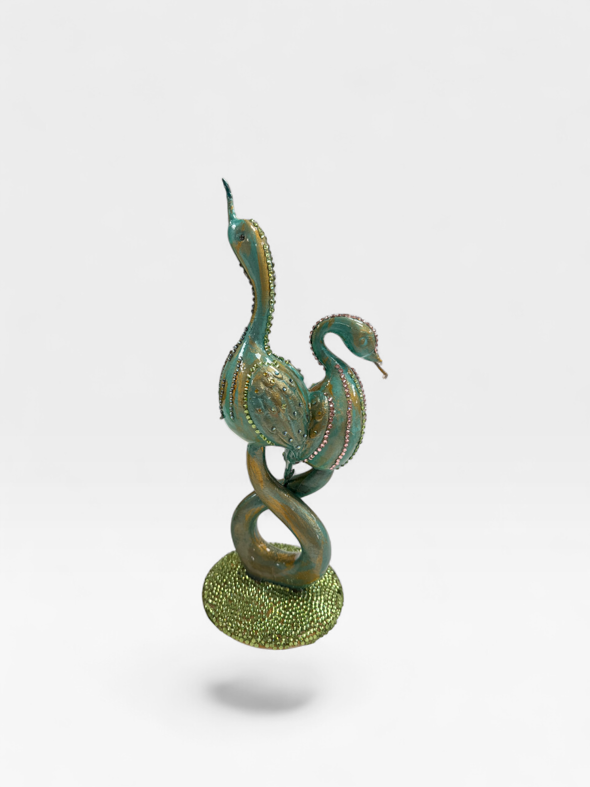 Entwined swans sculpture, teal and gold, other side