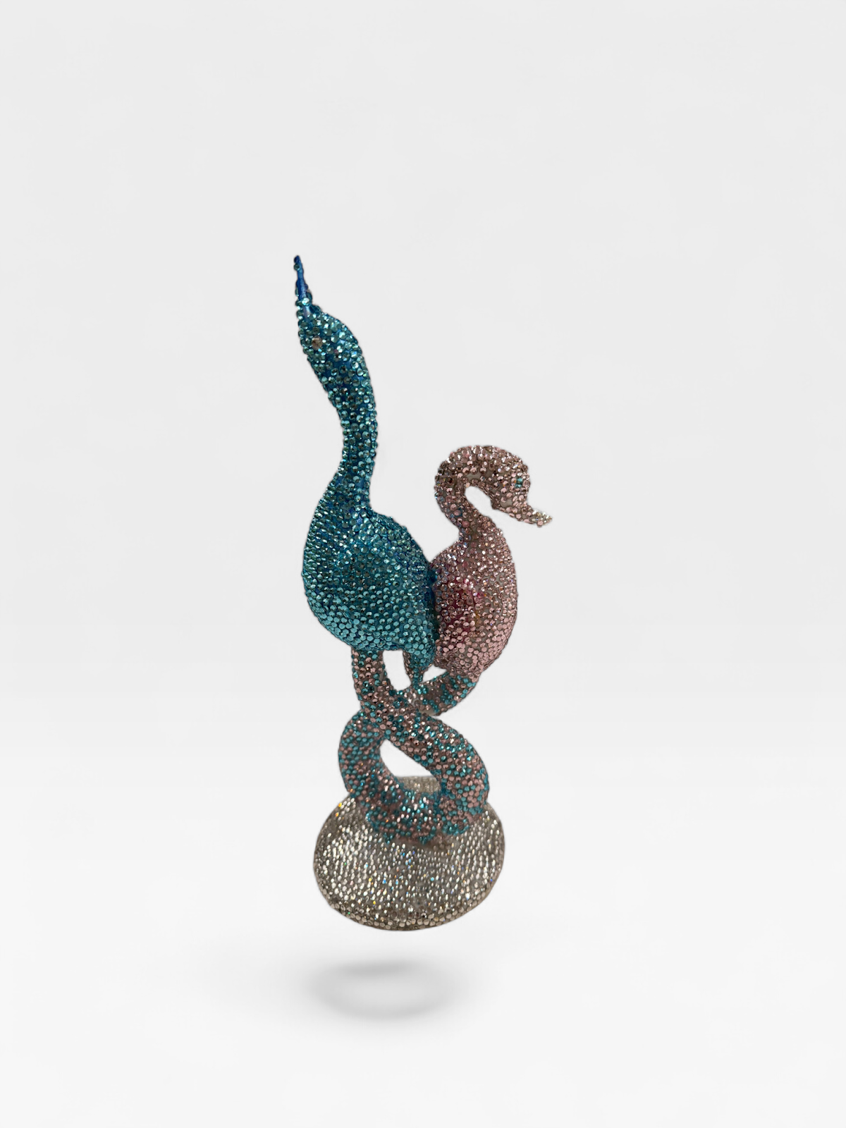 Turquoise and pink rhinestone swans, other side